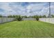 Expansive backyard with lush green grass, enclosed by a white vinyl privacy fence at 11315 Chilly Water Ct, Riverview, FL 33579