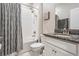 Well-lit bathroom featuring a shower over the tub and vanity with granite countertops at 11315 Chilly Water Ct, Riverview, FL 33579
