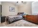 Cozy bedroom with a full-sized bed, neutral carpet, and lots of natural light at 11315 Chilly Water Ct, Riverview, FL 33579