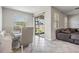 Bright dining area with large sliding doors leading to the lanai and backyard at 11315 Chilly Water Ct, Riverview, FL 33579