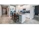 Bright kitchen boasts stainless steel appliances, granite countertops and a convenient center island at 11315 Chilly Water Ct, Riverview, FL 33579