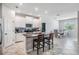 Stylish kitchen with granite counters, an island with seating, and views to the dining area at 11315 Chilly Water Ct, Riverview, FL 33579