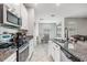 Beautiful kitchen boasts granite countertops and stainless steel appliances at 11315 Chilly Water Ct, Riverview, FL 33579