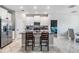 Modern kitchen features white cabinets, granite countertops, stainless steel appliances and a large island at 11315 Chilly Water Ct, Riverview, FL 33579
