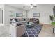 Bright living room with tile flooring, ample seating, and natural light at 11315 Chilly Water Ct, Riverview, FL 33579