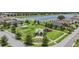 Aerial view of Crestview Lakes community park with playground, gazebo, and green space, near a pond at 11315 Chilly Water Ct, Riverview, FL 33579