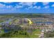 Overhead view of home with lake views, roads and houses in the surrounding neighborhood with an arrow for directions at 11327 Brighton Knoll Loop, Riverview, FL 33579