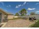 Serene backyard featuring a paver patio, grill, fire pit, and lush lawn, perfect for entertaining at 11327 Brighton Knoll Loop, Riverview, FL 33579
