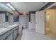 Bathroom with double sinks, tile flooring, and a separate shower at 11327 Brighton Knoll Loop, Riverview, FL 33579