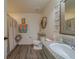 Full bathroom featuring wood-look flooring, modern toilet, and vanity at 11327 Brighton Knoll Loop, Riverview, FL 33579