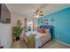 Bright bedroom with turtle decor and a large plant at 11327 Brighton Knoll Loop, Riverview, FL 33579