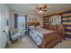Nautical themed bedroom featuring a wooden sleigh bed and matching furniture at 11327 Brighton Knoll Loop, Riverview, FL 33579