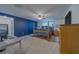 Comfortable bedroom featuring four-poster bed and desk at 11327 Brighton Knoll Loop, Riverview, FL 33579