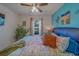 Comfortable bedroom with plant, turtle decor, and large window at 11327 Brighton Knoll Loop, Riverview, FL 33579