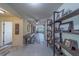 Inviting entryway featuring stylish flooring and decorative shelving; open to living area at 11327 Brighton Knoll Loop, Riverview, FL 33579