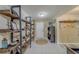 Open foyer with neutral paint, white door, decorative shelving, and ceramic tile flooring at 11327 Brighton Knoll Loop, Riverview, FL 33579