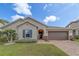 Charming home with brick walkway, two-car garage, well-manicured lawn, and appealing curb appeal at 11327 Brighton Knoll Loop, Riverview, FL 33579