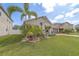 Charming home with lush landscaping, a well-manicured lawn, and a welcoming front entrance at 11327 Brighton Knoll Loop, Riverview, FL 33579