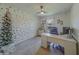 Bright home office with golden polka dot wall, ceiling fan, and comfortable workspace at 11327 Brighton Knoll Loop, Riverview, FL 33579