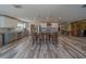 Open kitchen with large island, stainless appliances and barstool seating at 11327 Brighton Knoll Loop, Riverview, FL 33579