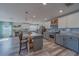 Modern kitchen featuring an island with barstool seating and stainless steel appliances at 11327 Brighton Knoll Loop, Riverview, FL 33579