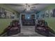 Spacious home theater with reclining seating and large screen for entertaining at 11327 Brighton Knoll Loop, Riverview, FL 33579