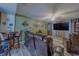 Finished basement with movie-themed décor and comfortable seating arrangement at 11327 Brighton Knoll Loop, Riverview, FL 33579