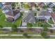 Overhead view of the property highlighting the home's backyard, including a patio area and green lawn enclosed by a white fence at 11327 Brighton Knoll Loop, Riverview, FL 33579