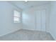 Bedroom featuring a window with blinds, carpet floor, and closet with a white double door at 11619 Cambium Crown Dr, Riverview, FL 33569