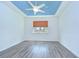 Bedroom with trey ceiling, ceiling fan, a window, and wood-look flooring at 11619 Cambium Crown Dr, Riverview, FL 33569