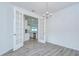 Dining room with chandelier and French doors looking into kitchen at 11619 Cambium Crown Dr, Riverview, FL 33569