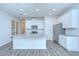 Stylish kitchen with a large center island, stainless steel appliances, and modern finishes at 11619 Cambium Crown Dr, Riverview, FL 33569
