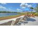 Relax and enjoy the scenery from the lounge area with shaded umbrellas and beautiful lake views at 11619 Cambium Crown Dr, Riverview, FL 33569