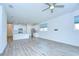 Bright, open-concept living room featuring modern flooring and ample natural light at 11619 Cambium Crown Dr, Riverview, FL 33569
