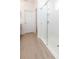 Bathroom featuring a stand up shower with glass door and neutral flooring at 11717 74Th E Cir, Palmetto, FL 34221