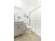 Bathroom featuring a glass-enclosed shower, a gray vanity, and wood-look tile flooring at 11717 74Th E Cir, Palmetto, FL 34221