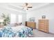 Bright bedroom featuring a ceiling fan, and two large windows at 11717 74Th E Cir, Palmetto, FL 34221
