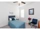 This bedroom showcases a serene retreat with a stylish chair, a bed, and a window with plantation shutters at 11717 74Th E Cir, Palmetto, FL 34221