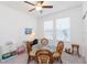 This room offers flexible living space, featuring a ceiling fan, built-ins, and a charming glass table at 11717 74Th E Cir, Palmetto, FL 34221