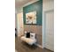 Stylish entryway features modern wall decor, accent pillows, and a cozy bench, creating a chic and inviting space at 11717 74Th E Cir, Palmetto, FL 34221