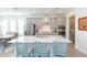 Bright kitchen with stainless steel appliances, island with seating, and quartz countertops at 11717 74Th E Cir, Palmetto, FL 34221