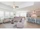 Bright open-concept living room and kitchen with stainless steel appliances and an eat-in kitchen at 11717 74Th E Cir, Palmetto, FL 34221