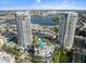 Stunning aerial view of luxury condo towers with pool and city skyline backdrop on a sunny day at 1209 E Cumberland Ave # 604, Tampa, FL 33602