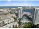 An aerial view captures a waterfront condo with pool, and a scenic harbor backdrop at 1209 E Cumberland Ave # 604, Tampa, FL 33602