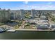An aerial view highlights a waterfront with dining, shopping, and dual condo towers near downtown at 1209 E Cumberland Ave # 604, Tampa, FL 33602