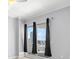 Bedroom featuring a sliding glass door to a balcony and city views at 1209 E Cumberland Ave # 604, Tampa, FL 33602