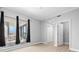 Bright bedroom featuring a balcony and a walk-in closet at 1209 E Cumberland Ave # 604, Tampa, FL 33602