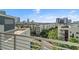 Enjoy this balcony's panoramic city view including lush greenery and modern architecture at 1209 E Cumberland Ave # 604, Tampa, FL 33602