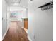 View through a hallway with hardwood floors, leading to an open living area with city views at 1209 E Cumberland Ave # 604, Tampa, FL 33602