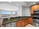 Stylish kitchen featuring granite countertops, stainless steel appliances, and an open view to the living space at 1209 E Cumberland Ave # 604, Tampa, FL 33602
